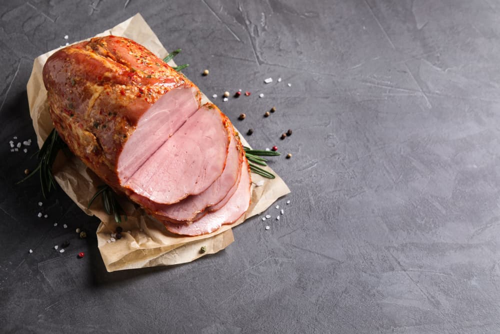 Sliced ham on gray table