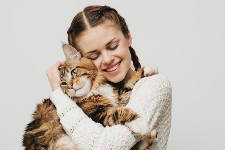 Woman hugging friendly cat